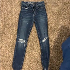 dark ripped american eagle jeans